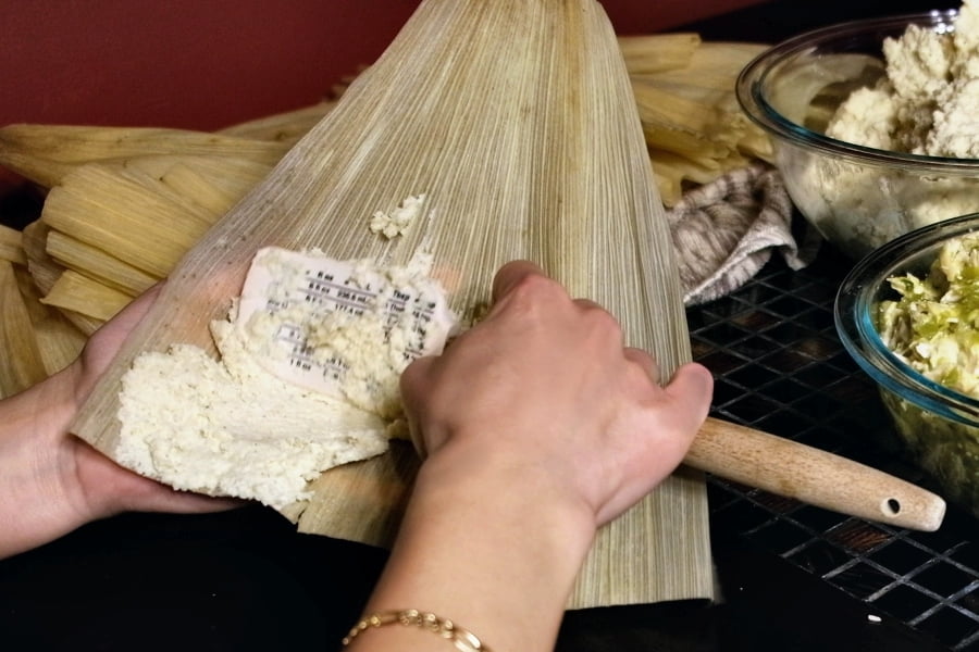 Spreading masa on tamale husk